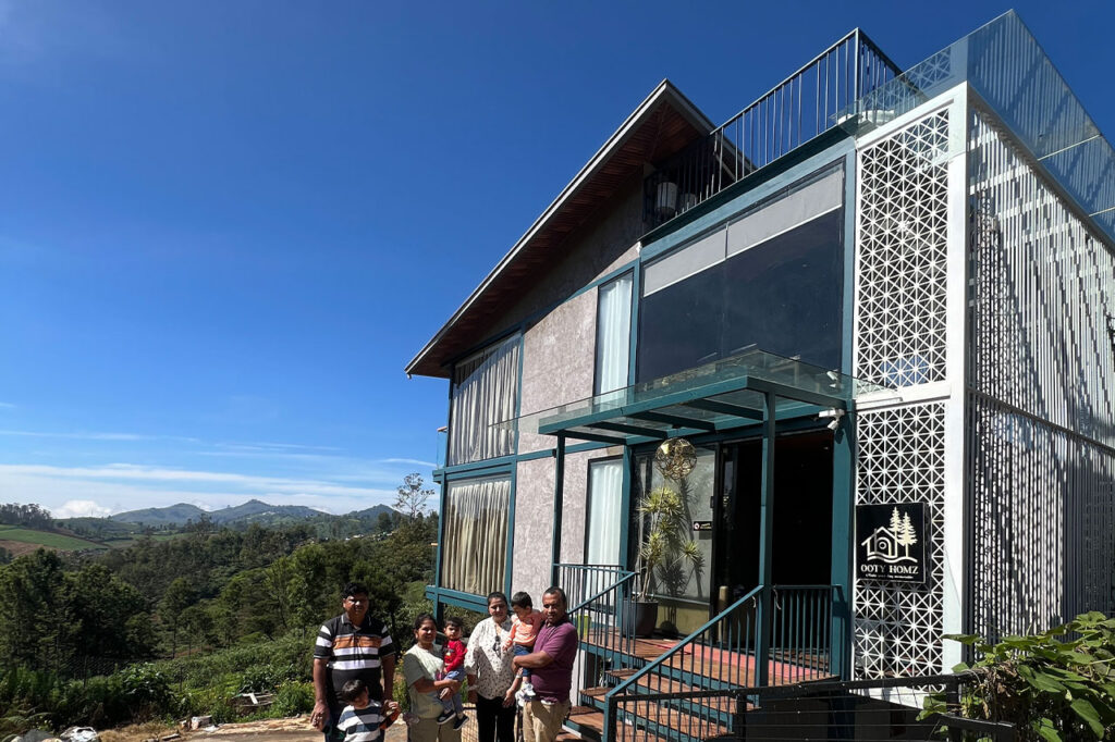 Luxury homestay in Ooty featuring glass-walled rooms, panoramic tea estate views, and premium amenities for an exclusive and serene getaway